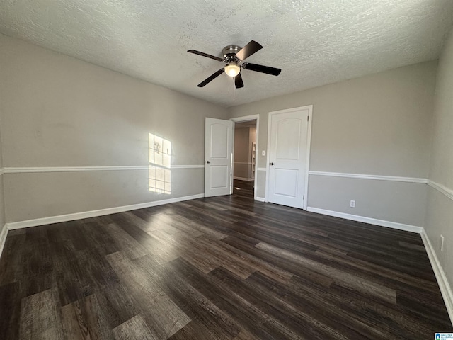 804 Elm Ave, Gadsden, AL 35903 - unfurnished bedroom with dark wood finished floors, baseboards, a textured ceiling, and a ceiling fan