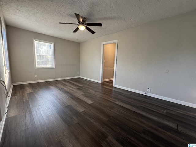 804 Elm Ave, Gadsden, AL 35903 - spare room featuring ceiling fan, dark wood-style flooring, baseboards, and a textured ceiling