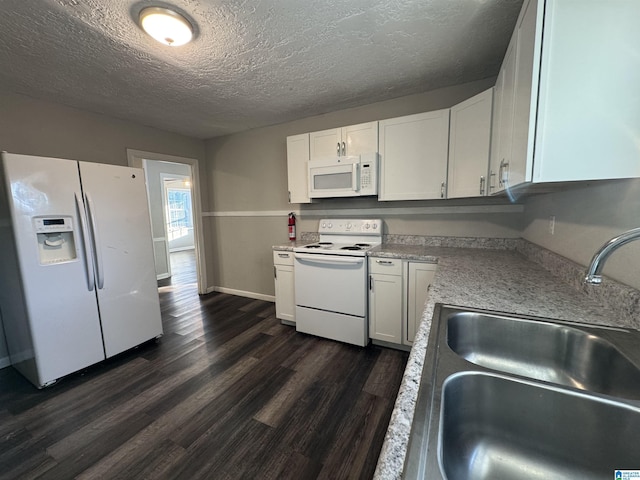 804 Elm Ave, Gadsden, AL 35903 - kitchen featuring white appliances, a sink, dark wood-style floors, a textured ceiling, and light countertops