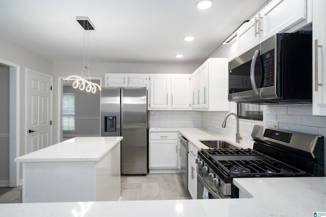 4100 S Shades Crest Rd, Hoover, AL 35244 - kitchen featuring appliances with stainless steel finishes, a sink, tasteful backsplash, recessed lighting, and a center island