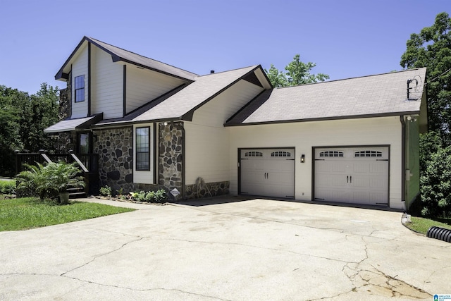 4100 S Shades Crest Rd, Hoover, AL 35244 - view of front of house featuring stone siding, concrete driveway, a garage, and a shingled roof