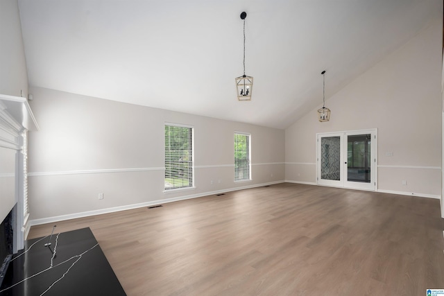 4100 S Shades Crest Rd, Hoover, AL 35244 - unfurnished living room with baseboards, high vaulted ceiling, wood finished floors, and a fireplace