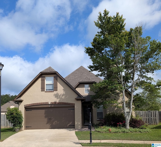 2212 Adkins Cir, Moody, AL 35004 - view of front of property featuring roof with shingles, concrete driveway, stucco siding, and an attached garage