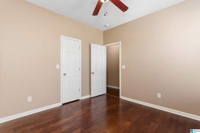 2212 Adkins Cir, Moody, AL 35004 - unfurnished bedroom with dark wood-style floors, baseboards, and a ceiling fan