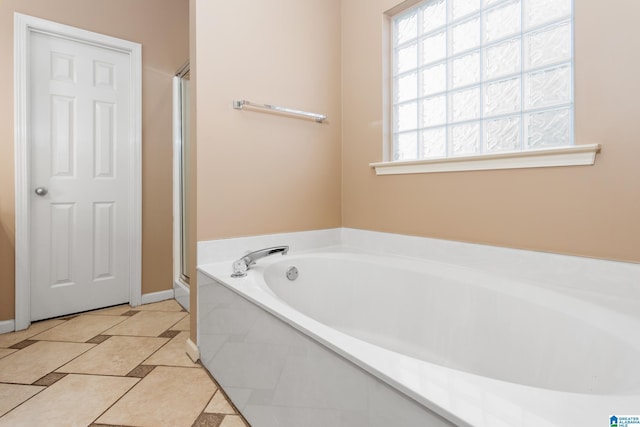 2212 Adkins Cir, Moody, AL 35004 - full bath featuring a shower stall, a bath, tile patterned floors, and baseboards