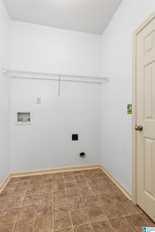 2212 Adkins Cir, Moody, AL 35004 - washroom with stone tile floors, electric dryer hookup, and baseboards