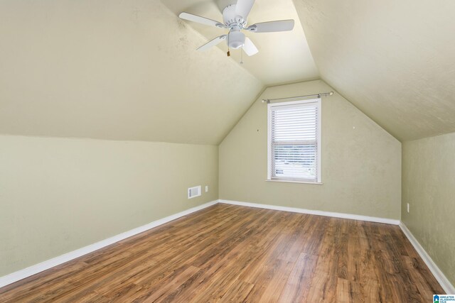 2212 Adkins Cir, Moody, AL 35004 - additional living space featuring wood finished floors, lofted ceiling, baseboards, and a ceiling fan