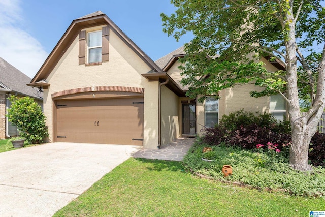 2212 Adkins Cir, Moody, AL 35004 - view of front of house with stucco siding, concrete driveway, and an attached garage