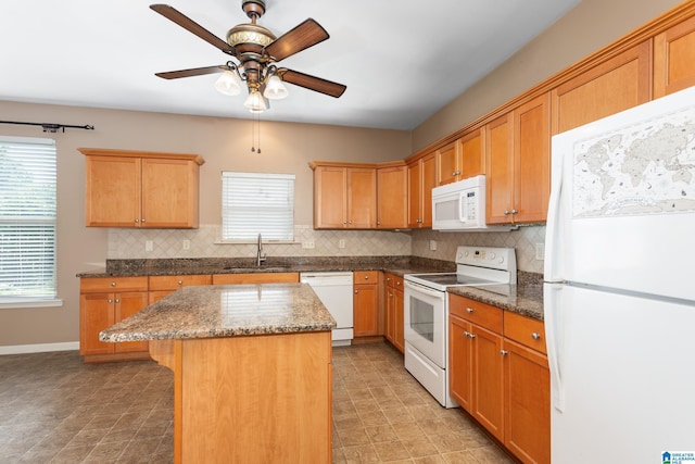 2212 Adkins Cir, Moody, AL 35004 - kitchen featuring white appliances, a sink, tasteful backsplash, a ceiling fan, and a kitchen island