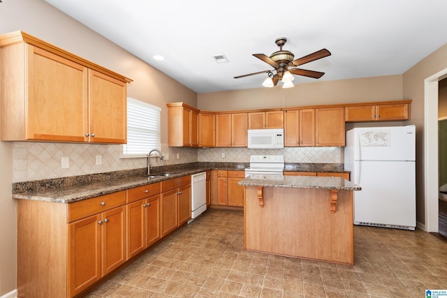 2212 Adkins Cir, Moody, AL 35004 - kitchen featuring white appliances, a sink, a ceiling fan, a kitchen island, and dark stone countertops