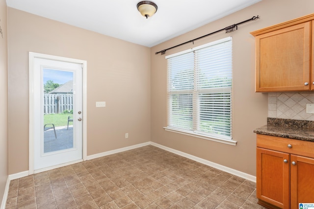 2212 Adkins Cir, Moody, AL 35004 - unfurnished dining area with plenty of natural light and baseboards