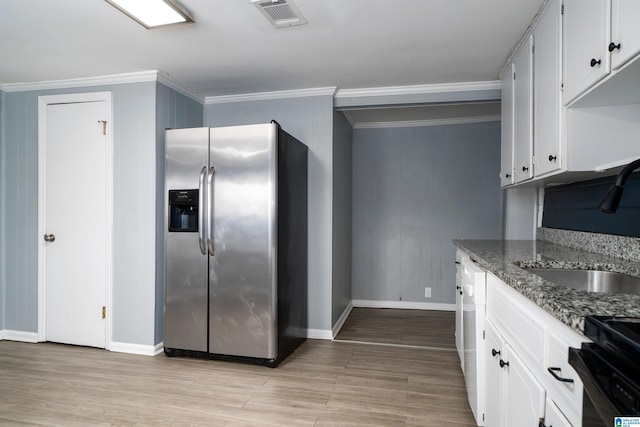 140 Camelia Ave, Gardendale, AL 35071 - kitchen with stainless steel fridge, a sink, ornamental molding, baseboards, and range