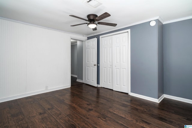 140 Camelia Ave, Gardendale, AL 35071 - unfurnished bedroom with crown molding, baseboards, dark wood-type flooring, a closet, and ceiling fan