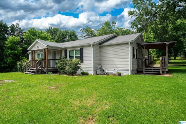 140 Camelia Ave, Gardendale, AL 35071 - view of front of house featuring covered porch, a front lawn, and a shingled roof