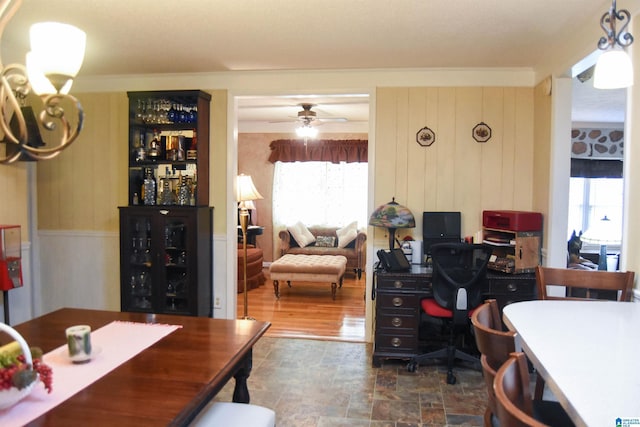 3908 Cloverdale Rd, Anniston, AL 36207 - dining room featuring a dry bar, stone finish flooring, a ceiling fan, and an office area