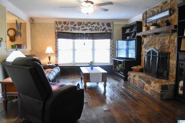 3908 Cloverdale Rd, Anniston, AL 36207 - living area with wood-type flooring, a ceiling fan, ornamental molding, and a stone fireplace