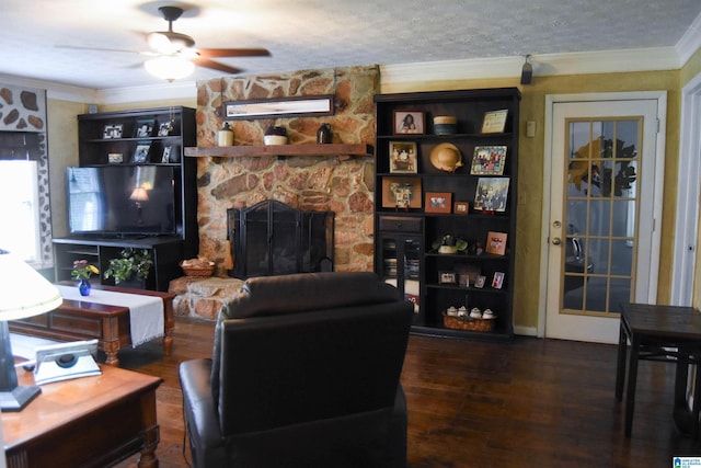 3908 Cloverdale Rd, Anniston, AL 36207 - living area with wood finished floors, ceiling fan, a fireplace, and ornamental molding