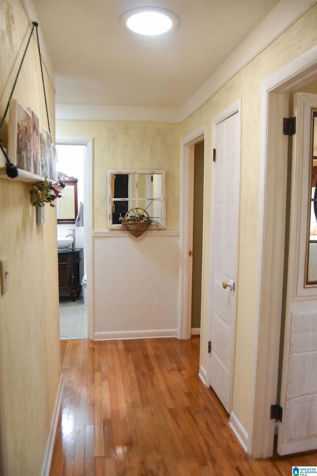 3908 Cloverdale Rd, Anniston, AL 36207 - hallway with light wood-style flooring and baseboards