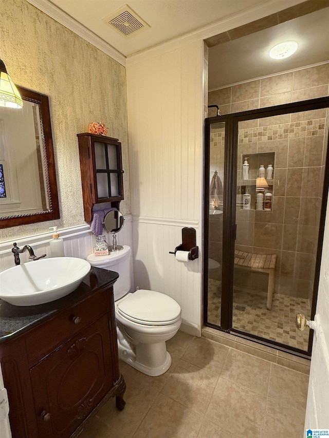 3908 Cloverdale Rd, Anniston, AL 36207 - full bathroom featuring a shower stall, vanity, toilet, tile patterned flooring, and ornamental molding