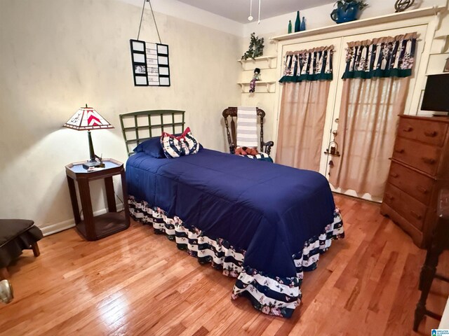 3908 Cloverdale Rd, Anniston, AL 36207 - bedroom featuring wood finished floors, french doors, and baseboards