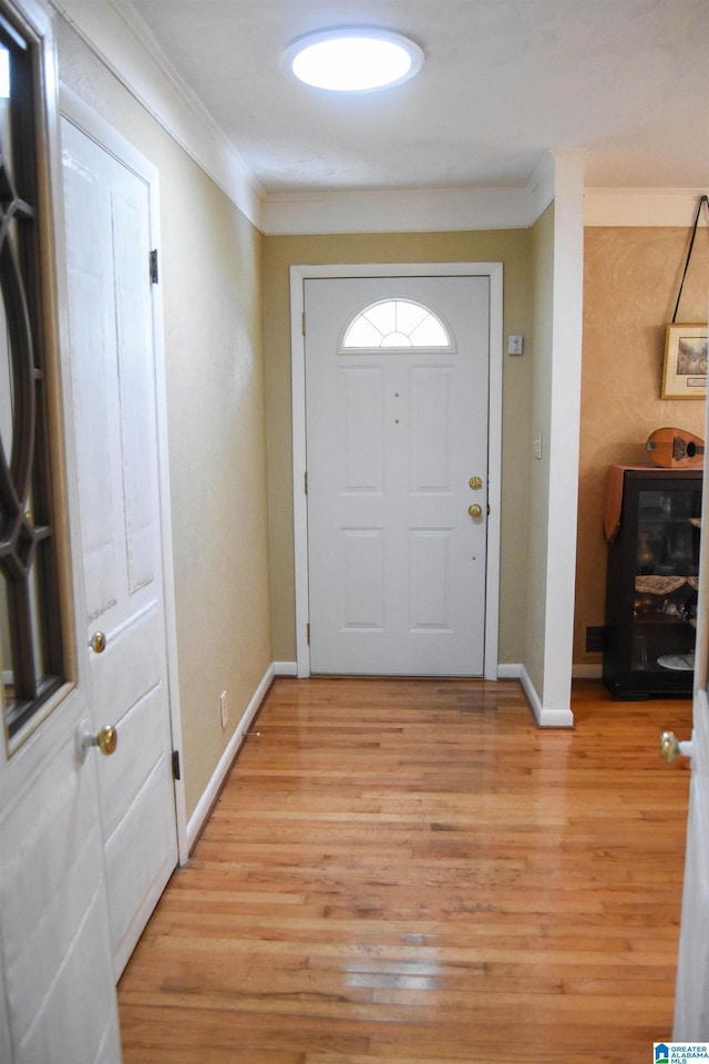 3908 Cloverdale Rd, Anniston, AL 36207 - entryway featuring ornamental molding, light wood finished floors, and baseboards