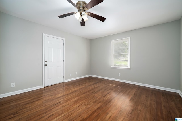 1644 1st St NE, Center Point, AL 35215 - spare room featuring dark wood-type flooring, baseboards, and ceiling fan