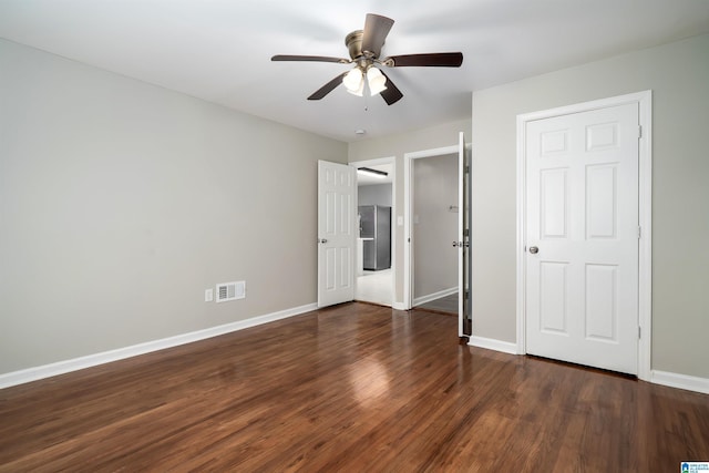 1644 1st St NE, Center Point, AL 35215 - unfurnished bedroom featuring baseboards, wood finished floors, and ceiling fan
