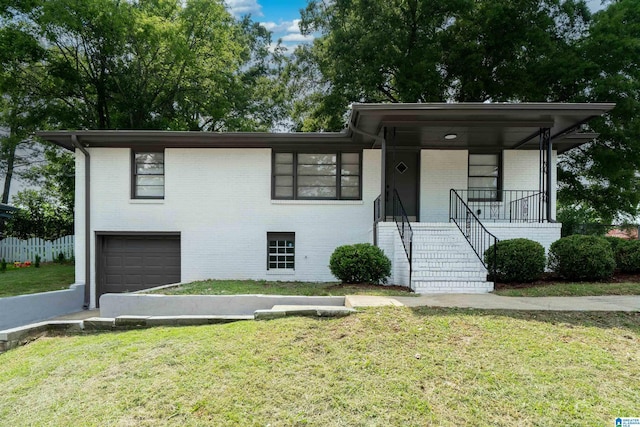 1644 1st St NE, Center Point, AL 35215 - view of front of home with brick siding, stairs, an attached garage, and a front lawn