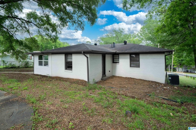 1644 1st St NE, Center Point, AL 35215 - rear view of property with cooling unit and brick siding