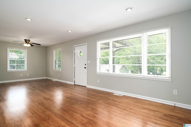 1644 1st St NE, Center Point, AL 35215 - unfurnished living room featuring ceiling fan, baseboards, wood finished floors, and recessed lighting