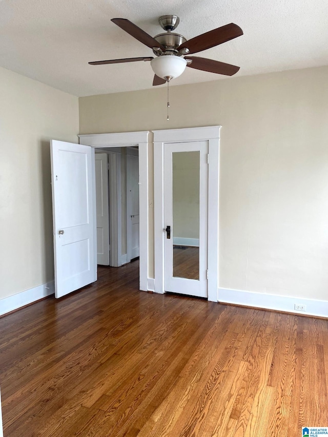 1428 11th Pl S, Birmingham, AL 35205 - unfurnished room featuring baseboards, a ceiling fan, and wood finished floors