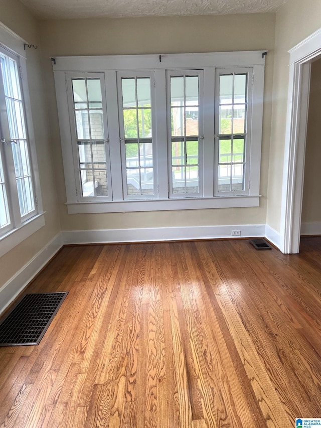 1428 11th Pl S, Birmingham, AL 35205 - unfurnished room featuring baseboards and wood finished floors