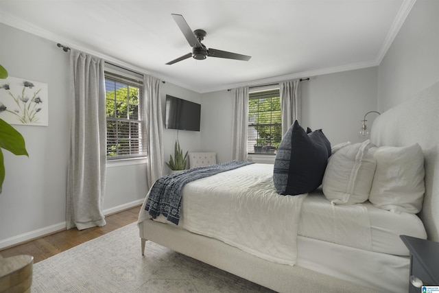 39 Edgehill Rd, Homewood, AL 35209 - bedroom with baseboards, multiple windows, wood finished floors, ornamental molding, and ceiling fan