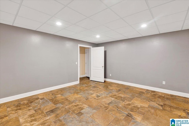 555 Ridgefield Way, Odenville, AL 35120 - unfurnished room featuring stone finish flooring, recessed lighting, baseboards, and a drop ceiling