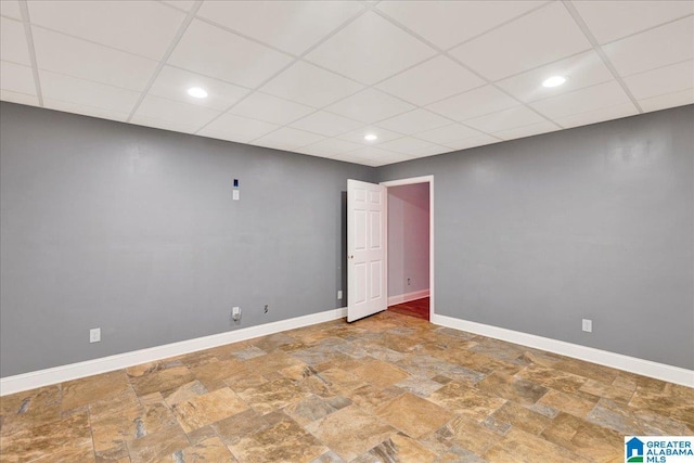 555 Ridgefield Way, Odenville, AL 35120 - unfurnished room featuring a paneled ceiling, stone finish flooring, baseboards, and recessed lighting