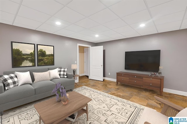 555 Ridgefield Way, Odenville, AL 35120 - living room featuring baseboards, stone finish flooring, a drop ceiling, and recessed lighting