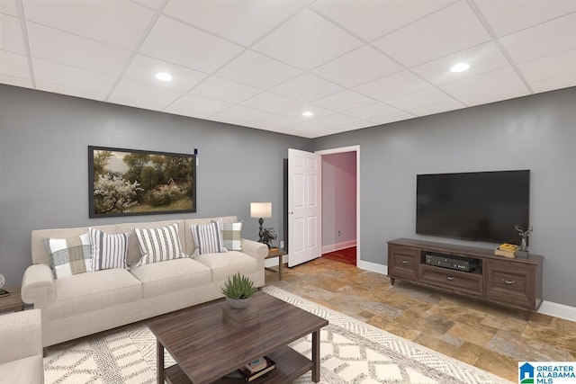 555 Ridgefield Way, Odenville, AL 35120 - living room featuring baseboards, stone finish flooring, a paneled ceiling, and recessed lighting