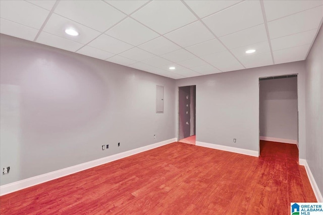555 Ridgefield Way, Odenville, AL 35120 - basement featuring electric panel, a paneled ceiling, wood finished floors, baseboards, and recessed lighting