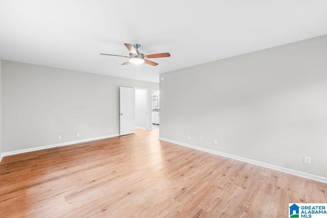 4010 93rd St, Northport, AL 35473 - empty room featuring a ceiling fan, light wood-style floors, and baseboards