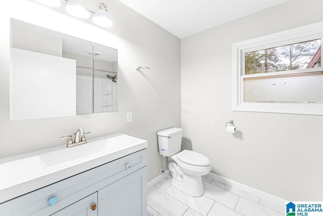 4010 93rd St, Northport, AL 35473 - bathroom with baseboards, marble look tile flooring, vanity, toilet, and a shower