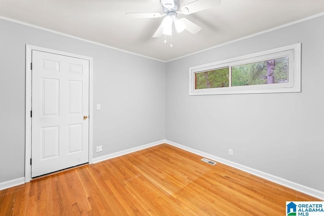 4010 93rd St, Northport, AL 35473 - unfurnished room with light wood finished floors, baseboards, ornamental molding, and a ceiling fan