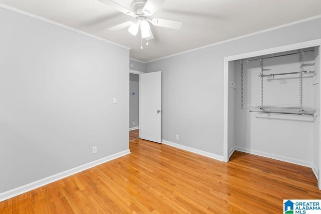 4010 93rd St, Northport, AL 35473 - unfurnished bedroom featuring baseboards, light wood-style flooring, crown molding, a closet, and a ceiling fan