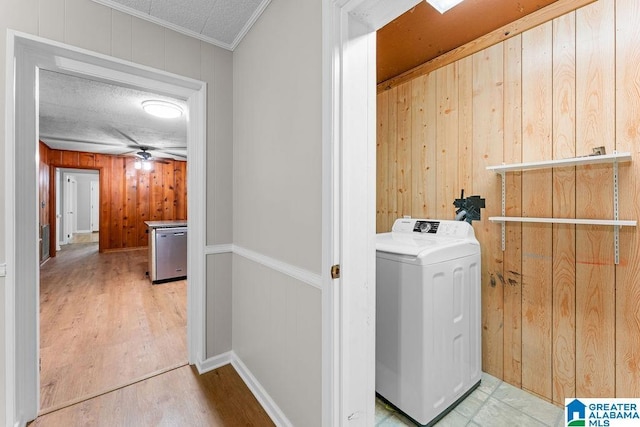 4010 93rd St, Northport, AL 35473 - laundry room with washer / dryer, wooden walls, wood finished floors, and crown molding