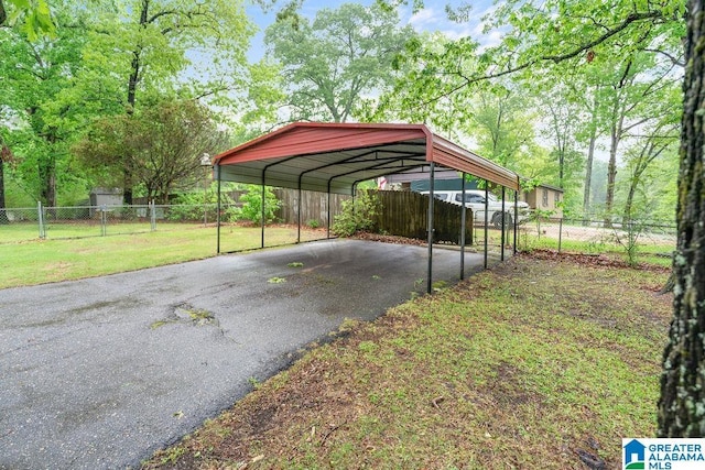 4010 93rd St, Northport, AL 35473 - view of parking with driveway and a carport