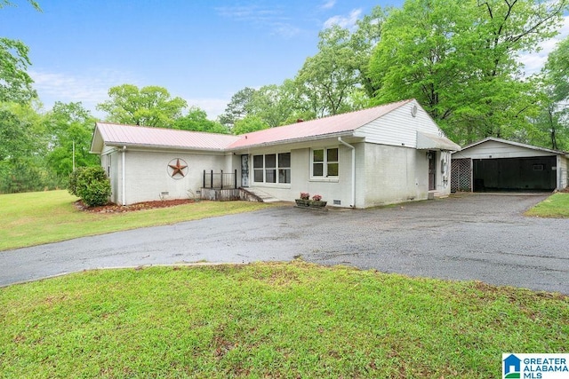 4010 93rd St, Northport, AL 35473 - ranch-style home featuring driveway, metal roof, and a front yard