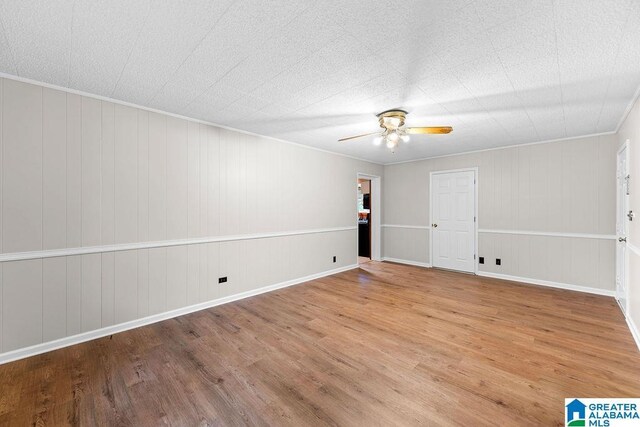 4010 93rd St, Northport, AL 35473 - unfurnished room featuring a ceiling fan, wood finished floors, and ornamental molding