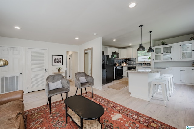 1320 Monticello St, Irondale, AL 35210 - living room with light wood finished floors and recessed lighting