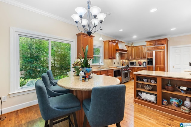 919 Sycamore Dr, Hoover, AL 35244 - dining space with a chandelier, crown molding, light wood-style flooring, baseboards, and recessed lighting