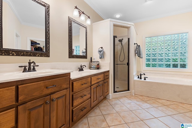 919 Sycamore Dr, Hoover, AL 35244 - full bathroom with ornamental molding, double vanity, a garden tub, a stall shower, and tile patterned flooring