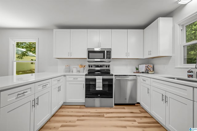 941 Honeysuckle Ln, Moody, AL 35094 - kitchen featuring stainless steel appliances, light countertops, and white cabinetry